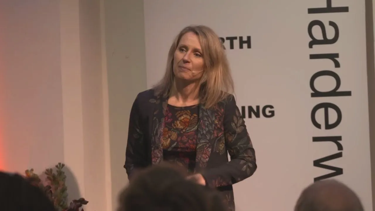 Kirsten speaking at a conference